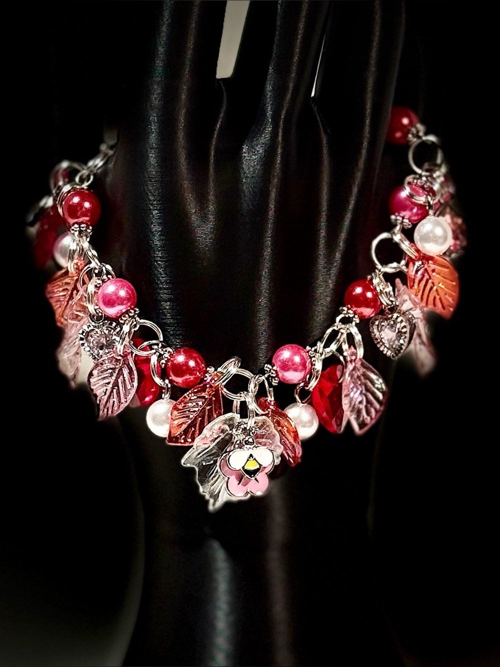 Handmade Red and Pink Charm Bracelet with Leaf and Flower Accents